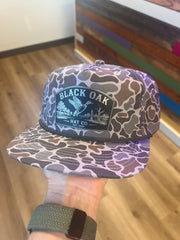 Black Oak leather patch hat with duck on the water on grey camo Blank Rope Hat